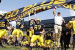 ANN ARBOR, MI - SEPTEMBER 05:  Head coach Rich Rodriguez enters the stadium with his team prior to playing the Western Michigan Broncos on September 5, 2009 at Michigan Stadium in Ann Arbor, Michigan.  (Photo by Gregory Shamus/Getty Images)