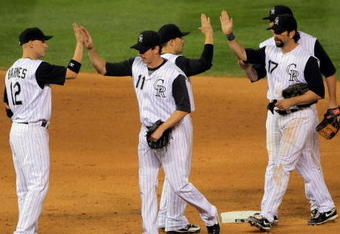 DENVER - SEPTEMBER 08:  The Colorado Rockies celebrate a win over the Cincinnati Reds at Coors Field on September 8, 2009 in Denver, Colorado. The Rockies defeated the Reds 3-1.  (Photo by Doug Pensinger/Getty Images)