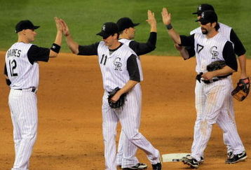 DENVER - SEPTEMBER 08:  The Colorado Rockies celebrate a win over the Cincinnati Reds at Coors Field on September 8, 2009 in Denver, Colorado. The Rockies defeated the Reds 3-1.  (Photo by Doug Pensinger/Getty Images)