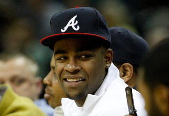 CHARLOTTE, NC - MARCH 03:  Former Texas Tech football player Michael Crabtree sits courtside during a game between the Chicago Bulls and Charlotte Bobcats at Time Warner Cable Arena on March 3, 2009 in Charlotte, North Carolina.  NOTE TO USER: User expressly acknowledges and agrees that, by downloading and/or using this Photograph, user is consenting to the terms and conditions of the Getty Images License Agreement.  (Photo by Streeter Lecka/Getty Images)