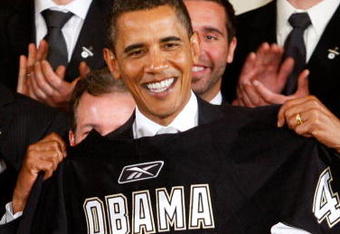 WASHINGTON - SEPTEMBER 10:  U.S. President Barack Obama is presented with a jersey from the Pittsburgh Penguins during an East Room event September 10, 2009 at the White House in Washington, DC. Obama hosted the Penguins to honor their 2009 Stanley Cup championship victory.  (Photo by Alex Wong/Getty Images)