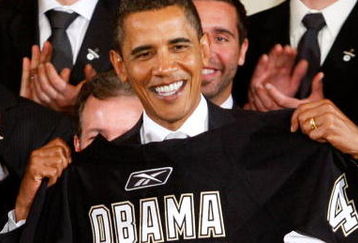 WASHINGTON - SEPTEMBER 10:  U.S. President Barack Obama is presented with a jersey from the Pittsburgh Penguins during an East Room event September 10, 2009 at the White House in Washington, DC. Obama hosted the Penguins to honor their 2009 Stanley Cup championship victory.  (Photo by Alex Wong/Getty Images)