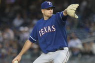 NEW YORK - JUNE 03: Scott Feldman #39 of the Texas Rangers pitches against the New York Yankees on June 3, 2009 at Yankee Stadium in the Bronx borough of New York City. (Photo by Nick Laham/Getty Images)