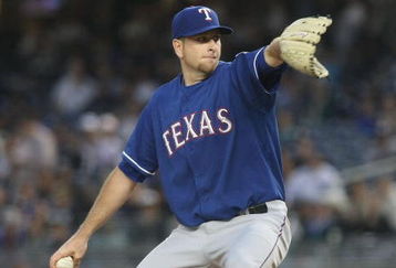 NEW YORK - JUNE 03:  Scott Feldman #39 of the Texas Rangers pitches against the New York Yankees on June 3, 2009 at Yankee Stadium in the Bronx borough of New York City.  (Photo by Nick Laham/Getty Images)