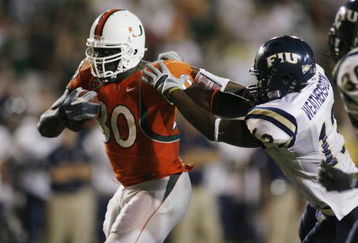 MIAMI - OCTOBER 14:  Tyrone Moss #30 of the Miami Hurricanes carries the ball against Jeremiah Weatherspoon #13 of the Florida International Panthers at the Orange Bowl on October 14, 2006 in Miami, Florida. Miami won 35-0.  (Photo by Marc Serota/Getty Images)