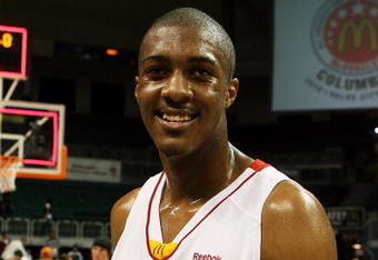 CORAL GABLES, FL - APRIL 01:  Derrick Favors #34 of the East Team shows off the John R. Wooden MVP Award trophy after defeating the West Team in the 2009 McDonald's All American Men's High School Basketball Game at BankUnited Center on April 1, 2009 in Coral Gables, Florida.  (Photo by Doug Benc/Getty Images)