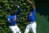 CHICAGO - AUGUST 30: Milton Bradley #21 and Kosuke Fukudome #1 of the Chicago Cubs avoid a collision as Bradley makes the catch against the New York Mets on August 30, 2009 at Wrigley Field in Chicago, Illinois. (Photo by Jonathan Daniel/Getty Images)