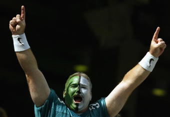 PHILADELPHIA - SEPTEMBER 29:  A painted fan of the Philadelphia Eagles goes crazy during the NFL game against the Houston Texans on September 29, 2002 at Veterens Stadium in Philadelphia, Pennsylvania.  The Eagles won 35-17.  (Photo by Al Bello/Getty Images)