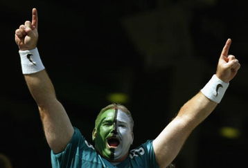 PHILADELPHIA - SEPTEMBER 29:  A painted fan of the Philadelphia Eagles goes crazy during the NFL game against the Houston Texans on September 29, 2002 at Veterens Stadium in Philadelphia, Pennsylvania.  The Eagles won 35-17.  (Photo by Al Bello/Getty Images)