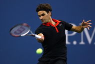 NEW YORK - SEPTEMBER 09:  Roger Federer of Switzerland returns a shot against Robin Soderling of Sweden during day ten of the 2009 U.S. Open at the USTA Billie Jean King National Tennis Center on September 9, 2009 in the Flushing neighborhood of the Queens borough of New York City.  (Photo by Chris McGrath/Getty Images)