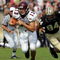 WEST LAFAYETTE, IN - SEPTEMBER 20:  Quarterback Dan LeFevour #13 of the Central Michigan Chippewas runs the ball past Ryan Kerrigan #94 of the Purdue Boilermakers at Ross-Ade Stadium on September 20, 2008 in West Lafayette, Indiana.  (Photo by Ronald Martinez/Getty Images)