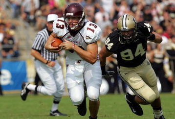 WEST LAFAYETTE, IN - SEPTEMBER 20:  Quarterback Dan LeFevour #13 of the Central Michigan Chippewas runs the ball past Ryan Kerrigan #94 of the Purdue Boilermakers at Ross-Ade Stadium on September 20, 2008 in West Lafayette, Indiana.  (Photo by Ronald Martinez/Getty Images)