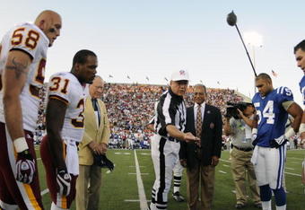 CANTON, OH - AUGUST 3: Referee Walt Coleman of the NFL directs  the coin toss as the Indianapolis Colts play against the Washington Redskins in the Pro Football Hall of Fame Game at Fawcett Stadium on August 3, 2008 in Canton, Ohio.   (Photo by Al Messerschmidt/Getty Images) 