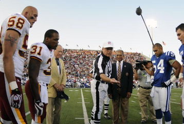 CANTON, OH - AUGUST 3: Referee Walt Coleman of the NFL directs  the coin toss as the Indianapolis Colts play against the Washington Redskins in the Pro Football Hall of Fame Game at Fawcett Stadium on August 3, 2008 in Canton, Ohio.   (Photo by Al Messerschmidt/Getty Images) 