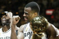 SAN ANTONIO, TX - JUNE 15:  David Robinson #50 and the San Antonio Spurs celebrate after winning Game six of the 2003 NBA Finals against the New Jersey Nets on June 15, 2003 at the SBC Center in San Antonio, Texas.  The Spurs won 88-77 and defeated the Nets to win the NBA Championship.  NOTE TO USER: User expressly acknowledges and agrees that, by downloading and/or using this Photograph, User is consenting to the terms and conditions of the Getty Images License Agreement.  (Photo by Jed Jacobsohn/Getty Images)