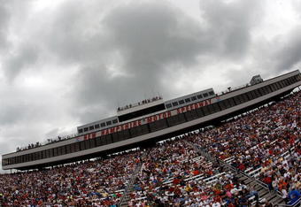 LOUDON, NH - JUNE 28:  Fans wait for the start of the NASCAR Sprint Cup Series LENOX Industrial Tools 301 under heavy rain clouds at New Hampshire Motor Speedway on June 28, 2009 in Loudon, New Hampshire.  (Photo by Chris Graythen/Getty Images)