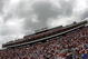 LOUDON, NH - JUNE 28: Fans wait for the start of the NASCAR Sprint Cup Series LENOX Industrial Tools 301 under heavy rain clouds at New Hampshire Motor Speedway on June 28, 2009 in Loudon, New Hampshire. (Photo by Chris Graythen/Getty Images)