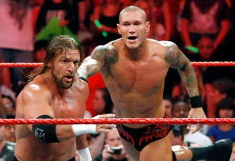LAS VEGAS - AUGUST 24:  Wrestlers Triple H (L) and Randy Orton compete during the WWE Monday Night Raw show at the Thomas & Mack Center August 24, 2009 in Las Vegas, Nevada.  (Photo by Ethan Miller/Getty Images)