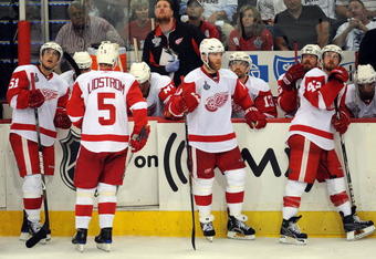 PITTSBURGH - JUNE 09:  Valtteri Filppula #51, Nicklas Lidstrom #5, Daniel Cleary #11 and Darren Helm #43 of the Detroit Red Wings look on from the bench while playing against the Pittsburgh Penguins during Game Six of the NHL Stanley Cup Finals at the Mellon Arena on June 9, 2009 in Pittsburgh, Pennsylvania.  (Photo by Harry How/Getty Images)