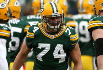 GREEN BAY, WI - NOVEMBER 30:  Aaron Kampman #74 of the Green Bay Packers takes the field during player ingtroductions against the Carolina Panthers at Lambeau Field on November 30, 2008 in Green Bay, Wisconsin. The Panthers won 35-31.  (Photo by Jonathan Daniel/Getty Images)