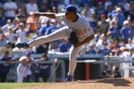 LOS ANGELES, CA - AUGUST 23:  Carlos Marmol #49 of the Chicago Cubs follows through on a pitch against the Los Angeles Dodgers in the ninth inning at Dodger Stadium on August 23, 2009 in Los Angeles, California. The Cubs defeated the Dodgers 3-1.  (Photo by Jeff Gross/Getty Images)