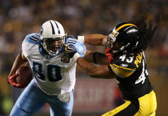 PITTSBURGH - SEPTEMBER 10:  Safety Troy Polamalu #43 of the Pittsburgh Steelers gets a penalty for holding the face mask of tight end Bo Scaife #80 of the Tennessee Titans during the second quarter of the NFL season opener at Heinz Field on September 10, 2009 in Pittsburgh, Pennsylvania. (Photo by Elsa/Getty Images)