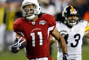 TAMPA, FL - FEBRUARY 01:  Wide receiver Larry Fitzgerald #11 of the Arizona Cardinals scores a 64-yard touchdown reception in the fourth quarter against Troy Polamalu #43 of the Pittsburgh Steelers during Super Bowl XLIII on February 1, 2009 at Raymond James Stadium in Tampa, Florida.  (Photo by Kevin C. Cox/Getty Images)