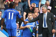 LONDON, ENGLAND - AUGUST 29:  Chelsea manager Carlo Ancelotti shakes the hand of Didier Drogba during the Barclays Premier League match between Chelsea and Burnley at Stamford Bridge on August 29, 2009 in London, England.  (Photo by Phil Cole/Getty Images)