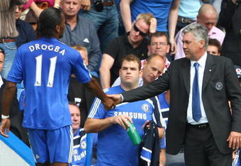 LONDON, ENGLAND - AUGUST 29:  Chelsea manager Carlo Ancelotti shakes the hand of Didier Drogba during the Barclays Premier League match between Chelsea and Burnley at Stamford Bridge on August 29, 2009 in London, England.  (Photo by Phil Cole/Getty Images)