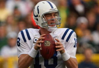 GREEN BAY, WI - OCTOBER 19:  Quarterback Peyton Manning #18 of the Indianapolis Colts throws a pass against the Green Bay Packers on October 19, 2008 at Lambeau Field in Green Bay Wisconsin. The Packers won 34-14.  (Photo by Stephen Dunn/Getty Images)