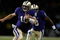 SEATTLE - SEPTEMBER 05:  Quarterback Jake Locker #10 of the Washington Huskies rushes against Rahim Alem #84 the LSU Tigers on September 5, 2009 at Husky Stadium in Seattle, Washington. The Tigers defeated the Huskies 31-23. (Photo by Otto Greule Jr/Getty Images)