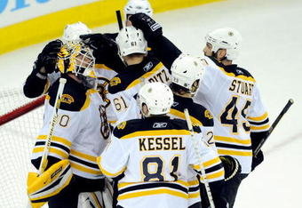 RALEIGH, NC - MAY 12:  Teammates congratulate goalkeeper Tim Thomas #30 of the Boston Bruins after a 4-2 win over the Carolina Hurricanes during Game Six of the Eastern Conference Semifinal Round of the 2009 Stanley Cup Playoffs on May 12, 2009 at the RBC Center in Raleigh, North Carolina. (Photo by Grant Halverson/Getty Images)