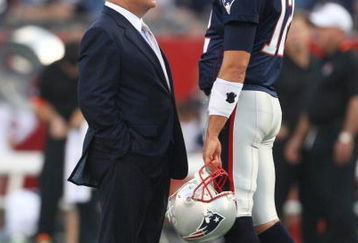 FOXBORO, MA - AUGUST 20:  Quarterback Tom Brady #12 (R) and team owner Robert Kraft of the New England Patriots talk on the field during warm ups against the Cincinnati Bengals during their preseason game at Gillette Stadium on August 20, 2009 in Foxboro, Massachusetts.  (Photo by Jim Rogash/Getty Images)