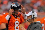 DENVER - AUGUST 30:  Head coach Josh McDaniels of the Denver Broncos talks with quarterback Kyle Orton #8 on the sidelines as they face the Chicago Bears during preseason NFL action at INVESCO Field at Mile High on August 30, 2009 in Denver, Colorado. The Bears defeated the Broncos 27-17.  (Photo by Doug Pensinger/Getty Images)