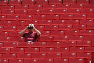 LANDOVER, MD - SEPTEMBER 12:  A fan of the Washington Redskins looks through binoculars during NFL week one against the Tampa Bay Buccaneers at FedEx Field on September 12, 2004 in Landover, Maryland. Redskins defeated the Buccaneers 16-10.  (Photo by Doug Pensinger/Getty Images)