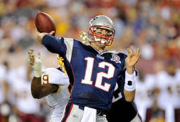 LANDOVER, MD - AUGUST 28:  Tom Brady #12 of the New England Patriots throws a touchdown to Randy Moss #81 (not pictured) in the first quarter of a preseason game against the Washington Redskins at FedExField on August 28, 2009 in Landover, Maryland.  (Photo by Greg Fiume/Getty Images)