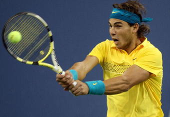 NEW YORK - SEPTEMBER 10:  Rafael Nadal of Spain returns a shot to Fernando Gonzalez of Chile during the Men's Singles Quarterfinals match on day eleven of the 2009 U.S. Open at the USTA Billie Jean King National Tennis Center on September 10, 2009 in the Flushing neighborhood of the Queens borough of New York City.  (Photo by Nick Laham/Getty Images)