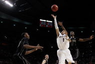 PORTLAND, OR - MARCH 21: Venoy Overton #1 of the Washington Huskies goes up for a shot against Keaton Grant #5 of the Purdue Boilermakers in the first half during the second round of the NCAA Division I Men's Basketball Tournament at the Rose Garden on March 21, 2009 in Portland, Oregon. (Photo by Jonathan Ferrey/Getty Images)