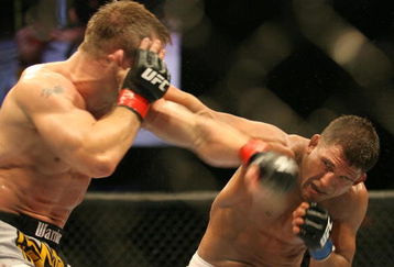 CHICAGO- OCTOBER 25: Sean Sherk (L) punches Tyson Griffin in a Lightweight bout at UFC's Ultimate Fight Night at Allstate Arena on October 25, 2008 in Chicago, Illinois. (Photo by Tasos Katopodis/Getty Images)