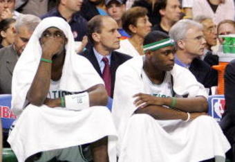 BOSTON - MAY 7: (L-R) Paul Pierce #34, Raef LaFrentz #45, Ricky Davis #12, and Marcus Banks #11 of the Boston Celtics watch the end of their game against the Indiana Pacers in Game seven of the Eastern Conference Quarterfinals during the 2005 NBA Playoffs at Fleet Center on May 7, 2005 in Boston, Massachusetts.  The Pacers defeated the Celtics 97-70 to win the series four games to three. NOTE TO USER: User expressly acknowledges and agrees that, by downloading and or using this photograph, User is consenting to the terms and conditions of the Getty Images License Agreement. (Photo by Jim McIsaac/Getty Images)    