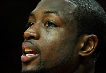 MIAMI - APRIL 25:  Dwyane Wade #3 of the Miami Heat cheers his team on from the bench in the fourth quarter against the Atlanta Hawks during Game Three of the Eastern Conference Quarterfinals at American Airlines Arena on April 25, 2009 in Miami, Florida. The Heat defeated the Hawks 107-78. NOTE TO USER: User expressly acknowledges and agrees that, by downloading and/or using this Photograph, user is consenting to the terms and conditions of the Getty Images License Agreement.  (Photo by Doug Benc/Getty Images)