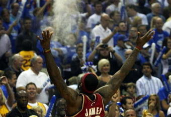 ORLANDO, FL - MAY 24:  LeBron James #23 of the Cleveland Cavaliers throws chalk in the air before the game against the Orlando Magic in Game Three of the Eastern Conference Finals during the 2009 NBA Playoffs at the the Amway Arena on May 24, 2009 in Orlando, Florida. NOTE TO USER: User expressly acknowledges and agrees that, by downloading and or using this photograph, User is consenting to the terms and conditions of the Getty Images License Agreement.  (Photo by Elsa/Getty Images)