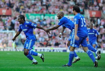 STOKE ON TRENT, ENGLAND - SEPTEMBER 12:  Florent Malouda of Chelsea celebrates scoring the winning goal with his team mates during the Barclays Premier League match between Stoke City and Chelsea at the Britannia Stadium on September 12, 2009 in Stoke on Trent, England.  (Photo by Michael Regan/Getty Images)