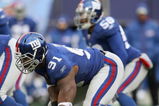 EAST RUTHERFORD, NJ - DECEMBER 7:  Justin Tuck #91 of the New York Giants gets ready on the line of scrimmage against the Philadelphia Eagles at Giants Stadium on December 7, 2008 in East Rutherford, New Jersey. (Photo by Nick Laham/Getty Images)