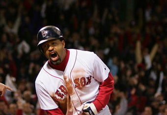 BOSTON - OCTOBER 17:  Dave Roberts #31 of the Boston Red Sox celebrates after scoring the game-tying run on a single by Bill Mueller #11 in the ninth inning against the New York Yankees during game four of the American League Championship Series on October 17, 2004 at Fenway Park in Boston, Massachusetts.  (Photo by Ezra Shaw/Getty Images)