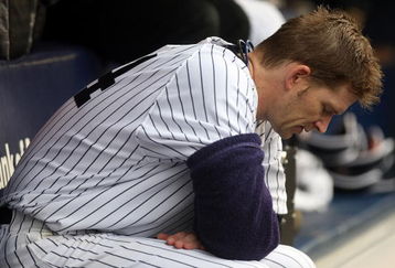 NEW YORK - SEPTEMBER 12:  A.J. Burnett #34 of the New York Yankees sits in the dugout against the Baltimore Orioles on September 12, 2009 at Yankee Stadium in the Bronx borough of New York City.  (Photo by Nick Laham/Getty Images)