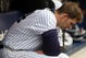 NEW YORK - SEPTEMBER 12:  A.J. Burnett #34 of the New York Yankees sits in the dugout against the Baltimore Orioles on September 12, 2009 at Yankee Stadium in the Bronx borough of New York City.  (Photo by Nick Laham/Getty Images)