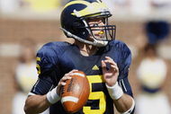 ANN ARBOR, MI - SEPTEMBER 05:  Tate Forcier #5 of the Michigan Wolverines gets ready to throw a second quarter pass while playing the Western Michigan Broncos on September 5, 2009 at Michigan Stadium in Ann Arbor, Michigan.  (Photo by Gregory Shamus/Getty Images)