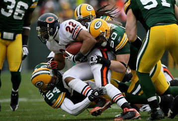 GREEN BAY, WI - NOVEMBER 16:  Running back Matt Forte #22 of the Chicago Bears is stopped by linebackers A.J. Hawk #50 and Brandon Chillar #53 of the Green Bay Packers during the NFL game at Lambeau Field on November 16, 2008 in Green Bay, Wisconsin.  (Photo by Doug Pensinger/Getty Images)