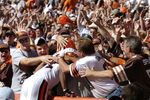 CLEVELAND - AUGUST 21:  Running back Lee Suggs #44 of the Cleveland Browns is welcomed into the Dawg Pound after scoring a touchdown during the second quarter of the pre-season game between the Cleveland Browns and the Detroit Lions on August 21, 2004 at Cleveland Browns Stadium in Cleveland, Ohio. Cleveland defeated Detroit 17-10.  (Photo by David Maxwell/Getty Images)